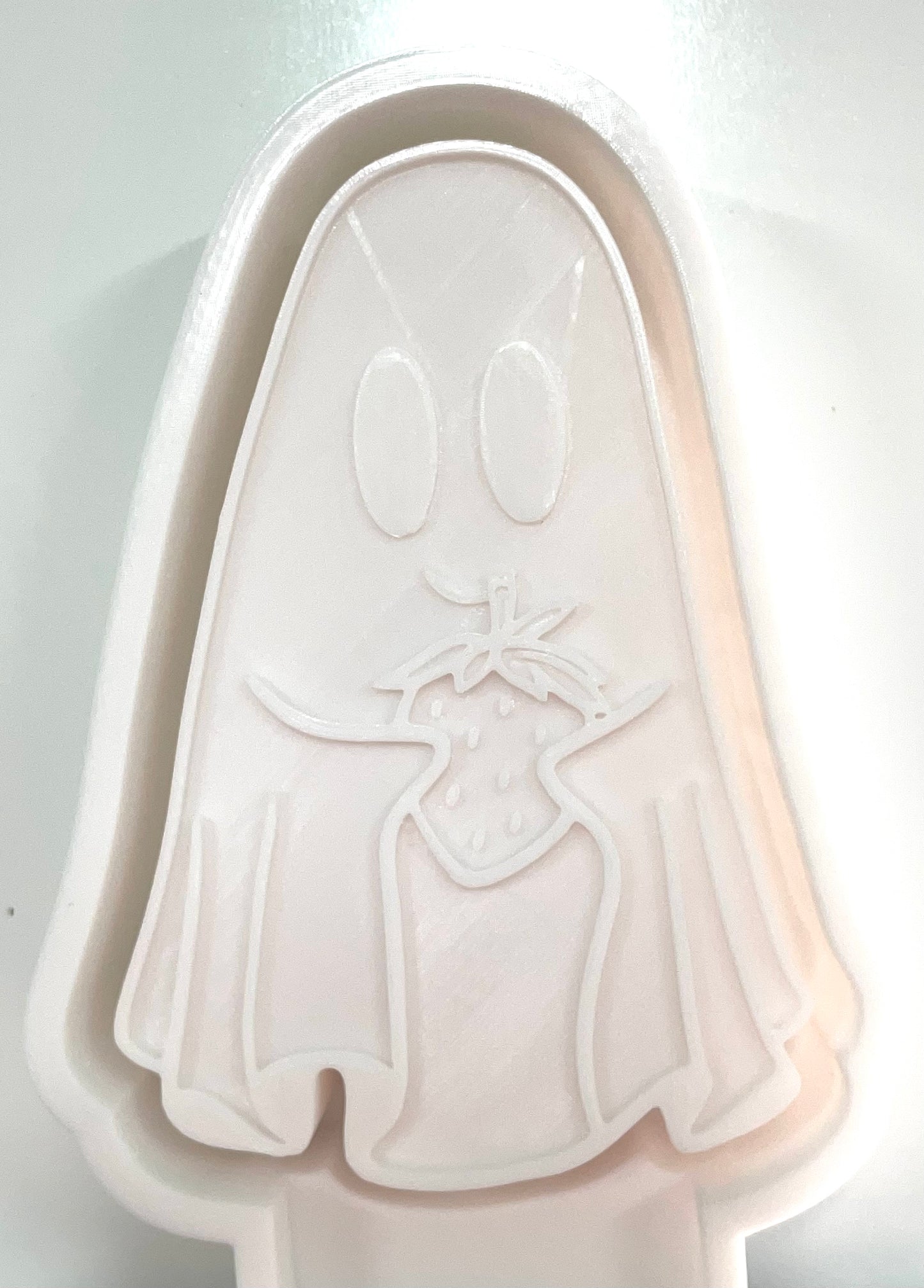 Ghost Holding Strawberry Mold